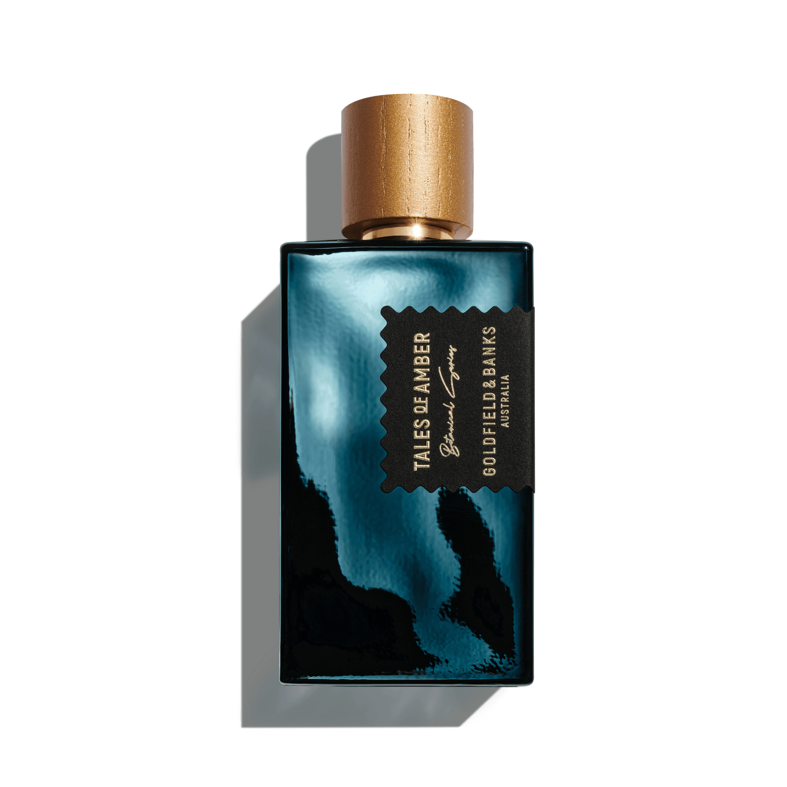 Tales of Amber perfume bottle with black and gold design and wooden cap